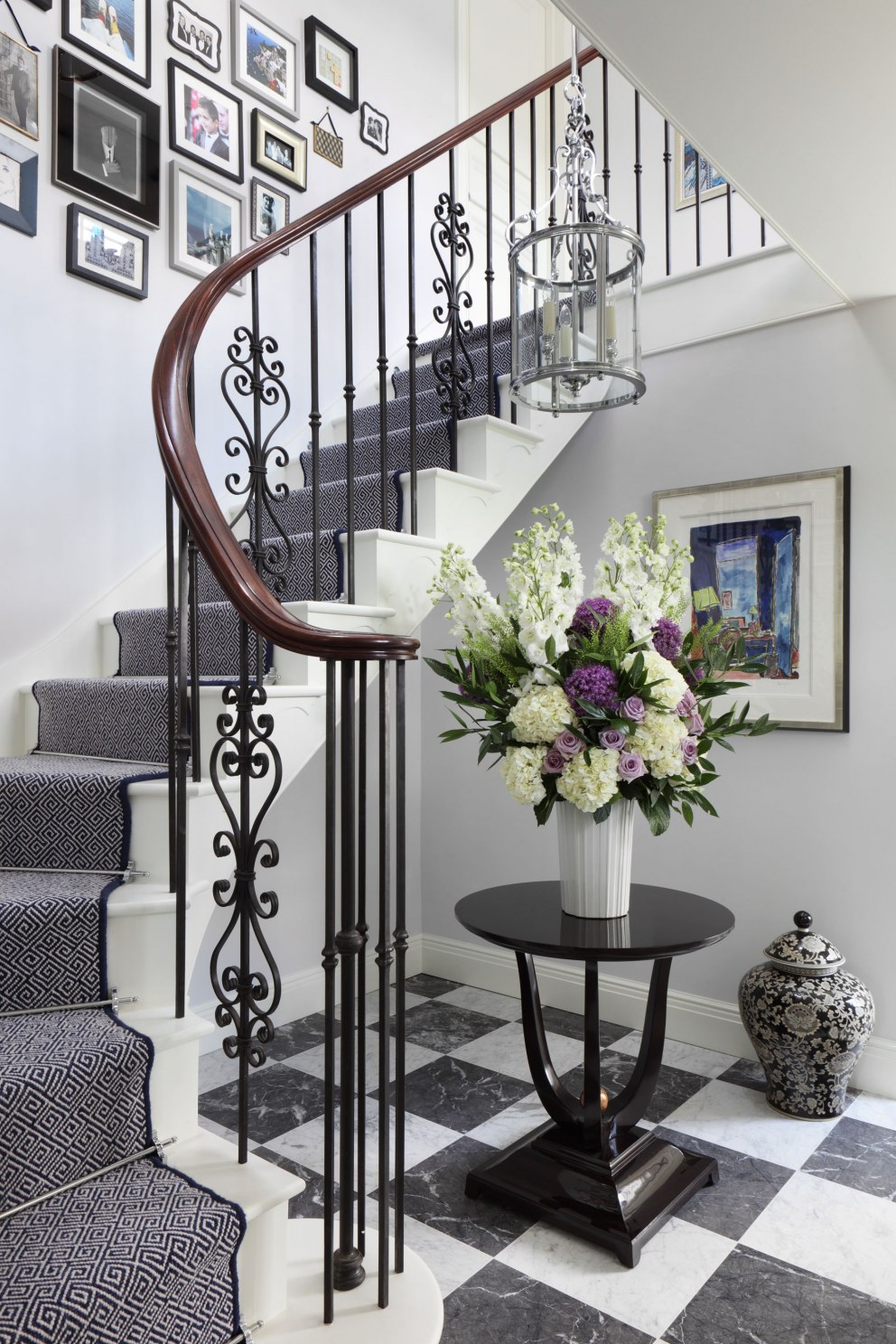 Bedfordshire Countryside Family Home | Entrance Hall with a statement checkerboard marble floor | Interior Designers